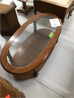 Oval glass top coffee table