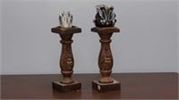 Pair of carved wooden candlestick holders with