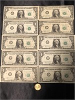 10- Washington one dollar bills and one 2000 gold