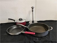Group of pans, pot, and paper towel holder