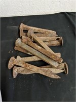Box of old railroad spikes