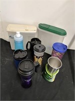 Group of travel mugs and 2 cereal containers