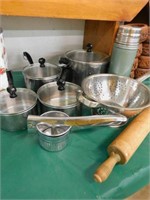 household lot-pans, colander, Stanley thermos