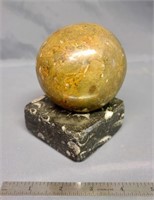 Marble ball on marble base