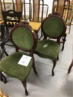pair green sitting chairs