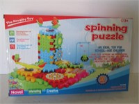THE NOVELTY TOY-SPINNING PUZZLE
