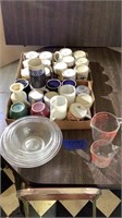 Mixing bowls and Pyrex measuring cups and mugs