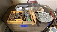 Utensils, silverware, platters, and heavy glass