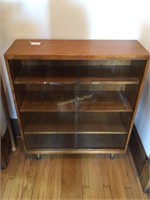 Cabinet with glass doors and three shelves