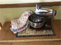 Sunbeam mixer (works),  cover, and placemat