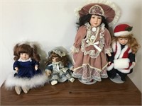 Lot of 4 porcelain dolls