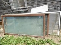 2 glass sliding doors w/ wood frames