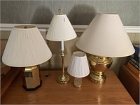 Four brass like table lamps.