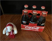 Six pack of classic Coca-Cola Bottles