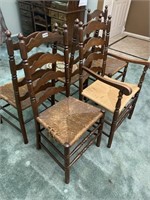 Four matching ladder back chairs.