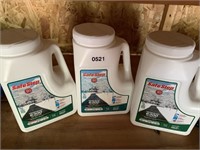 Three containers of Safe Step Ice Melt.