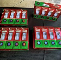Four boxes of  NIB Titleist DT Roll Golf balls.