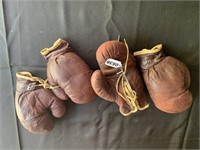 Two pairs of Vintage boxing gloves.
