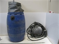 Tarp, Blue Barrel and Electrical  Cord
