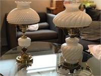 A pair of hobnail and milk glass lamps with brass