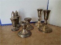 2 1/2 and 5 " candlesticks and 4 1/2" shakers