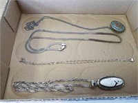 Four necklaces and pendants both pendants and a