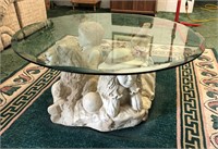 Glass top coffee table/ round w/dog & kids