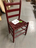 red chair - woven sear -- could use repair
