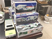 7 Hess Trucks with some ware on boxes, one no box