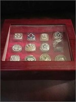 Sports ring collection with display case.
