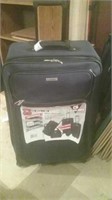 Black stand-up rolling suitcase with clothing