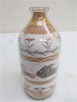 Fish design sand art in bottle