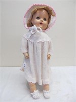 Antique doll in crocheted outfit