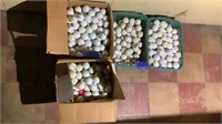 Four boxes of golf balls