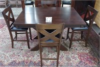 Heavy wood table with 4 stools & expandable leaf,