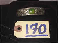 Silver Chinese bracelet with green stone, carving