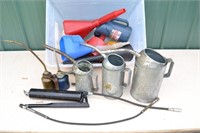 Collection of oil cans, funnels, grease gun