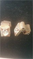 Pair of gold tone cufflinks with clear Stone