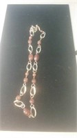 Large link gold tone necklace with beads