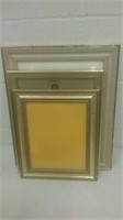 Group of three gold picture frames various sizes