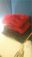 Big stack of blue and red bathroom rugs new