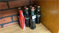 8 Coca-Cola Bottles and 1 Aluminum Coca-Cola
