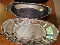 two silver plate oval dishes