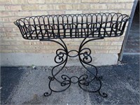 Wrought iron plant stand.
