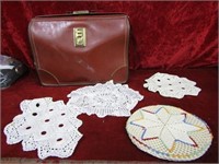 Vintage doilies and leather case.