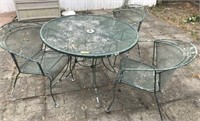 WROUGHT IRON TABLE AND 3 ARM CHAIRS,