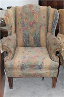 Vintage upholstered chair with flower patterns