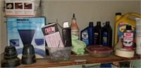 Contents of shelf Lucas Oil, Car vac, insulators