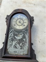 CLOCK WITH BIRDS ON FRONT