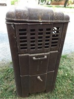 Antique Montgomery Ward stove.  33” tall
